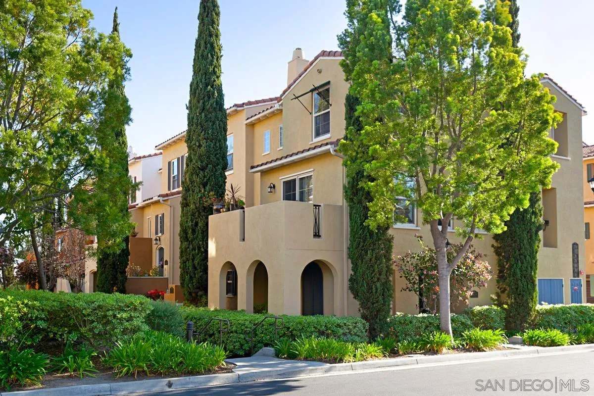 2248 Huntington Point Road, Unit 80 Chula Vista, CA 91914 - Photo 2 of 31 a view of a white building among the bunch of trees