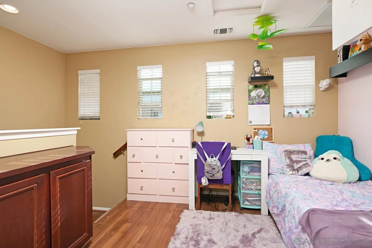 2248 Huntington Point Road, Unit 80 Chula Vista, CA 91914 - Photo 26 of 31 a bedroom with a bed and a window