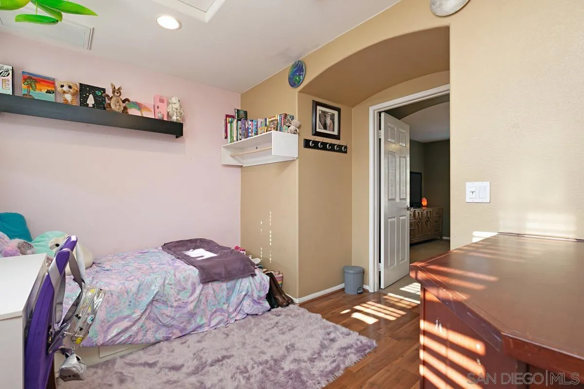 2248 Huntington Point Road, Unit 80 Chula Vista, CA 91914 - Photo 27 of 31 a bedroom with a bed and a dresser in it