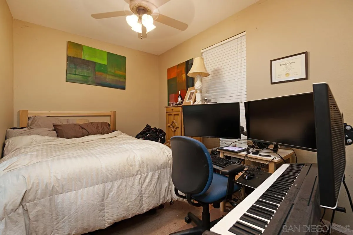 2248 Huntington Point Road, Unit 80 Chula Vista, CA 91914 - Photo 28 of 31 a bedroom with a bed and a flat screen tv