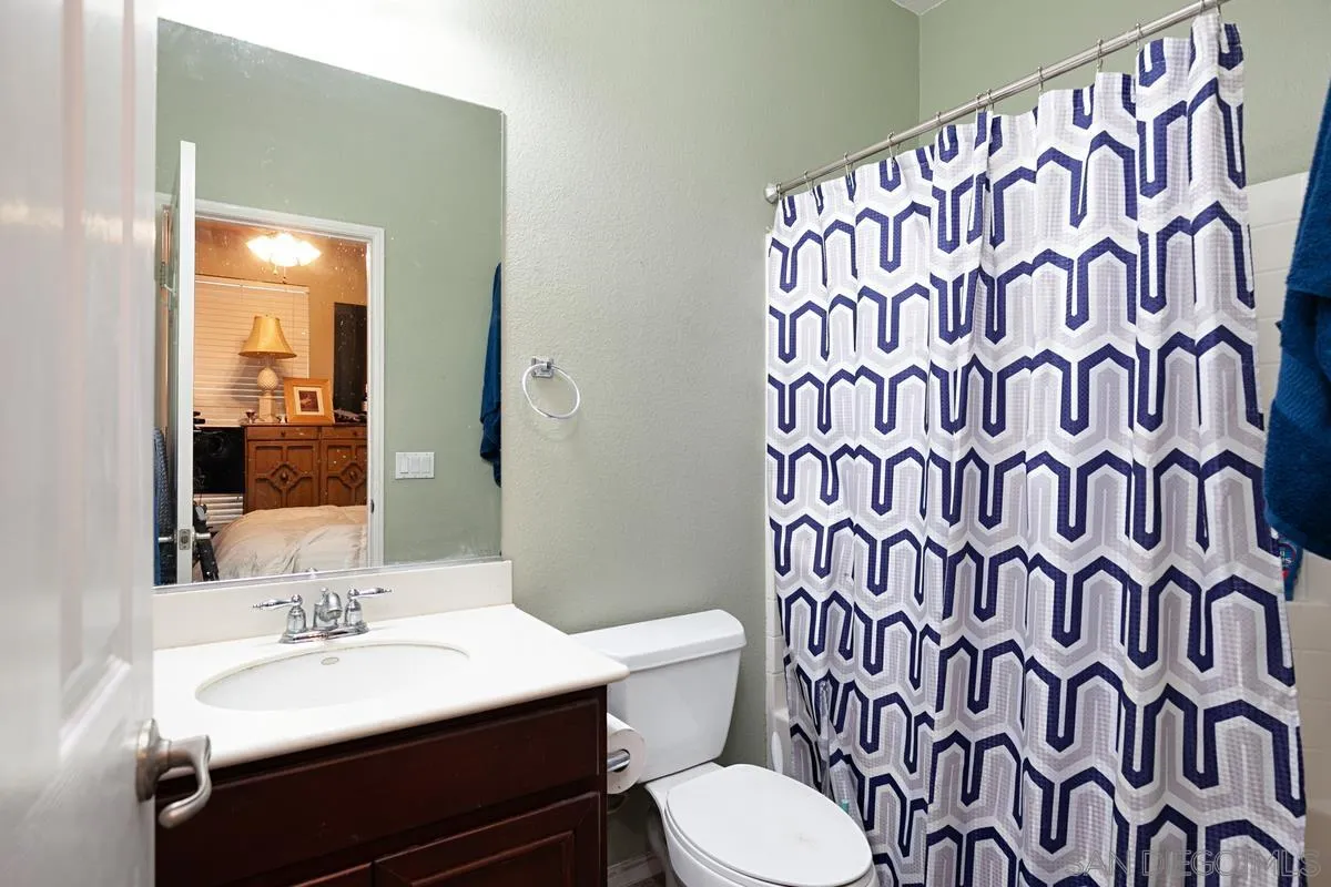 2248 Huntington Point Road, Unit 80 Chula Vista, CA 91914 - Photo 29 of 31 a bathroom with a sink and a mirror