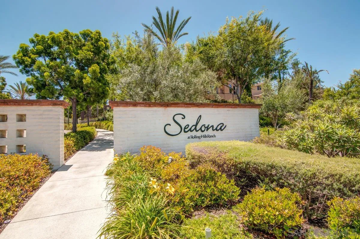 2248 Huntington Point Road, Unit 80 Chula Vista, CA 91914 - Photo 30 of 31 a sign broad in front of a white house