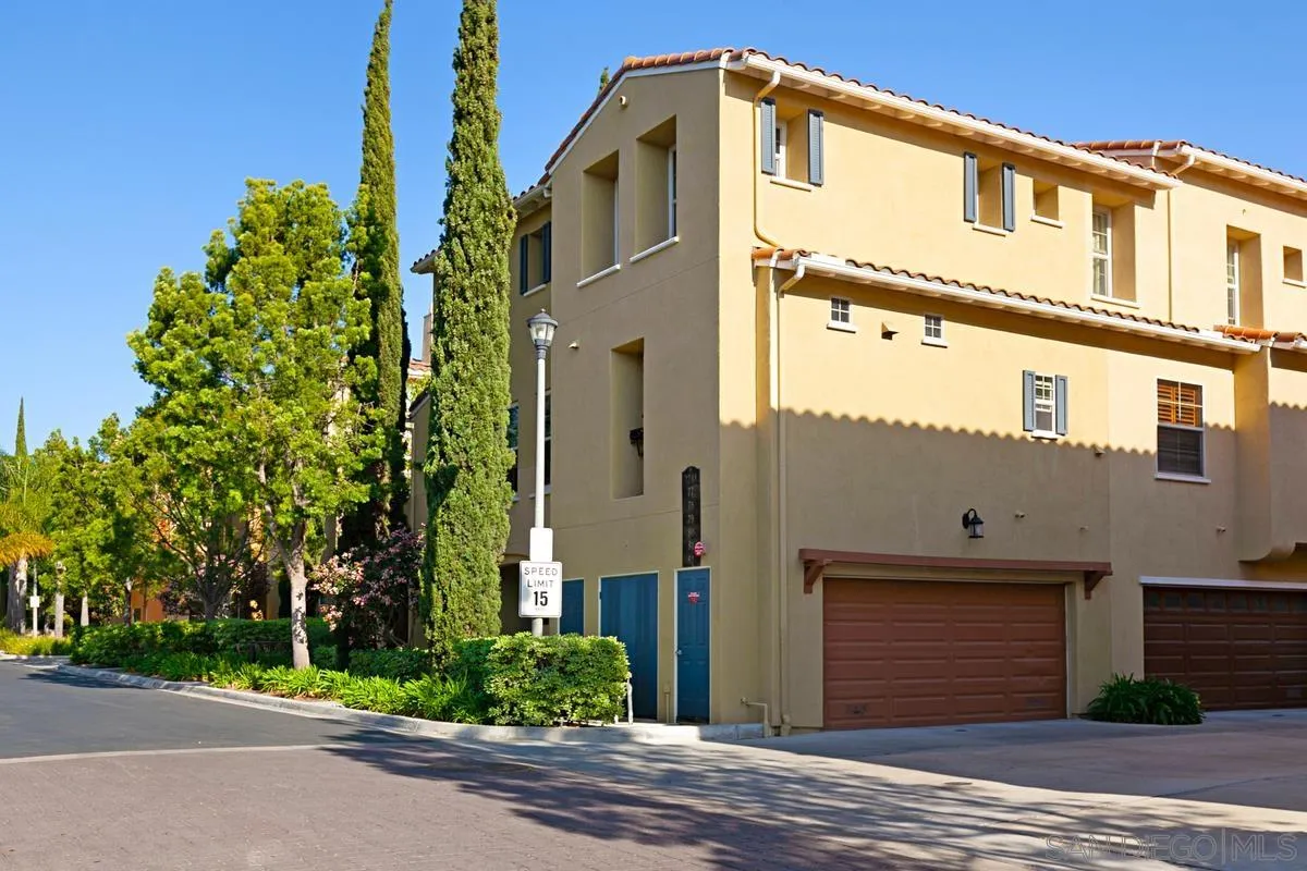 2248 Huntington Point Road, Unit 80 Chula Vista, CA 91914 - Photo 4 of 31 a front view of a house with a garden