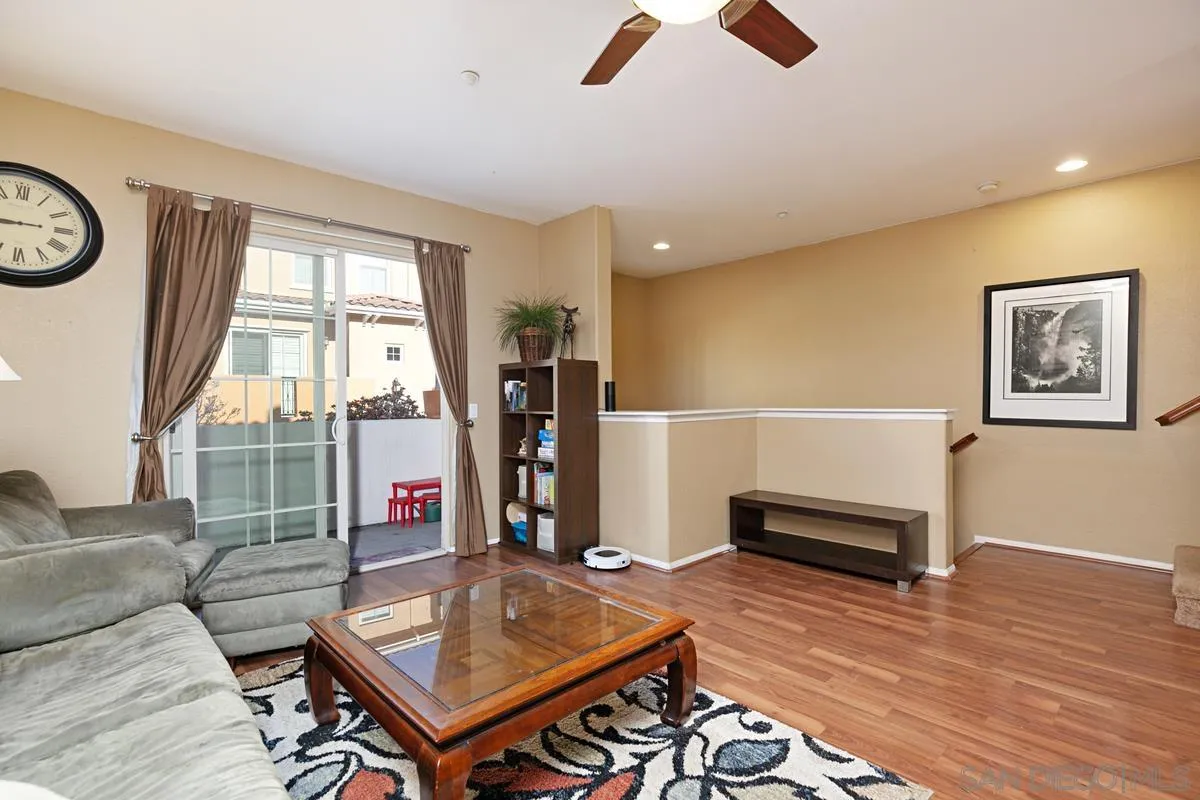 2248 Huntington Point Road, Unit 80 Chula Vista, CA 91914 - Photo 9 of 31 a living room with furniture a rug and a window