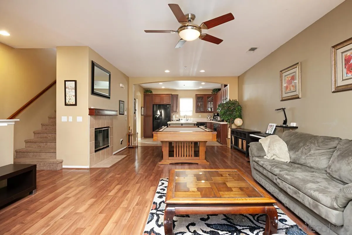 2248 Huntington Point Road, Unit 80 Chula Vista, CA 91914 - Photo 10 of 31 a living room with furniture and a fireplace
