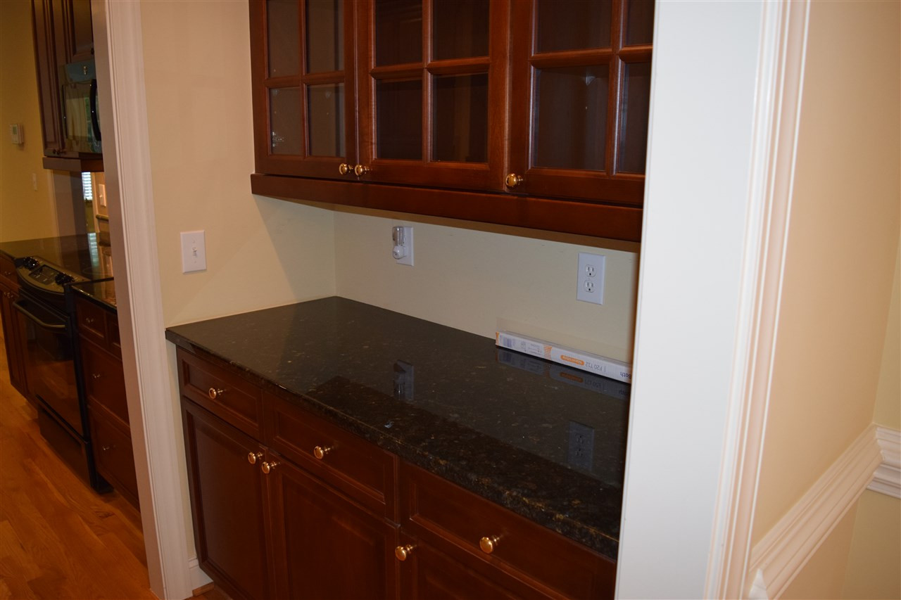 9307 Tabriz Point Raleigh, NC 27614 - Photo 11 of 24 Butler's pantry between dinning room and kitchen. Butler's Pantry