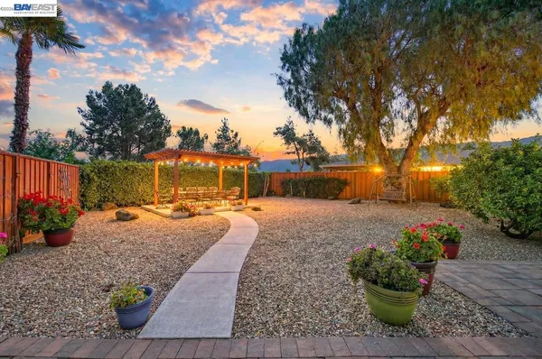 a view of a backyard with sitting area