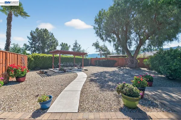 a view of a backyard with sitting area