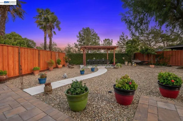 a view of a backyard with sitting area