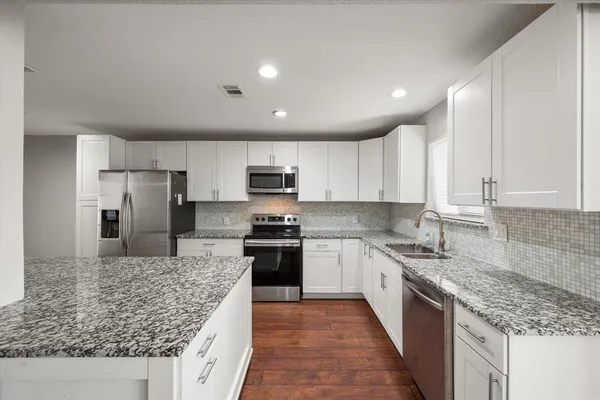 a view of room with a ceiling fan and window