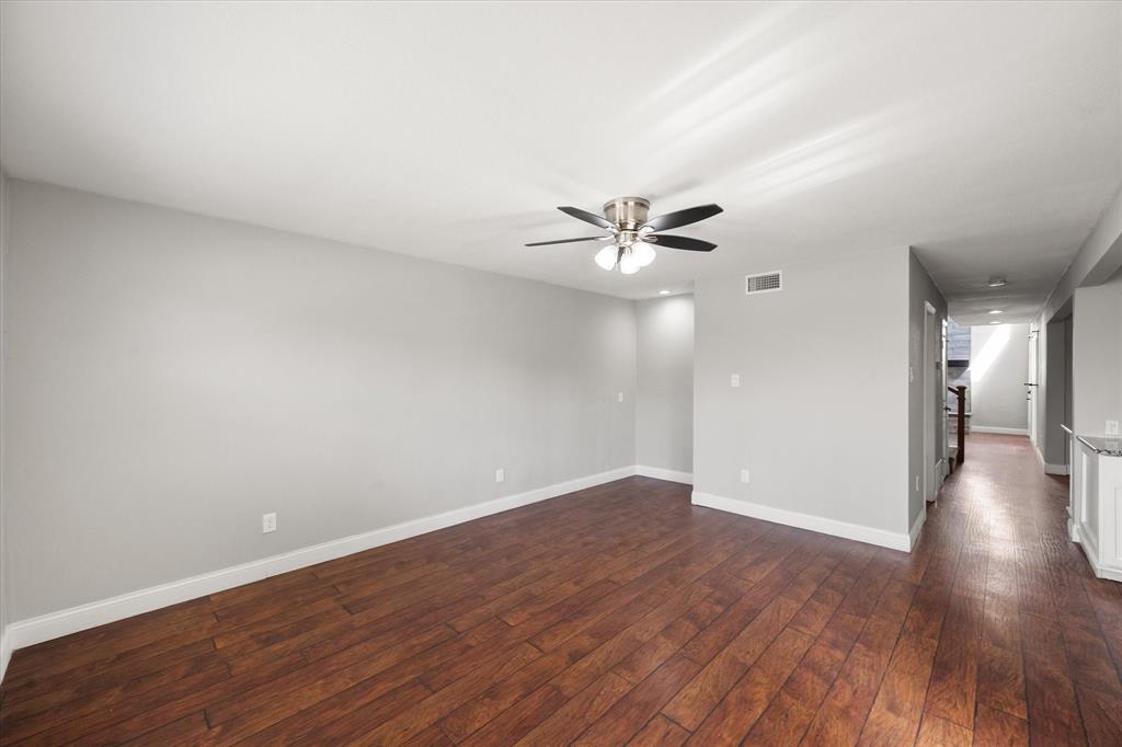 207 East Harwood Road, Unit 10 Euless, TX 76039 - Photo 17 of 34 a view of an empty room with wooden floor