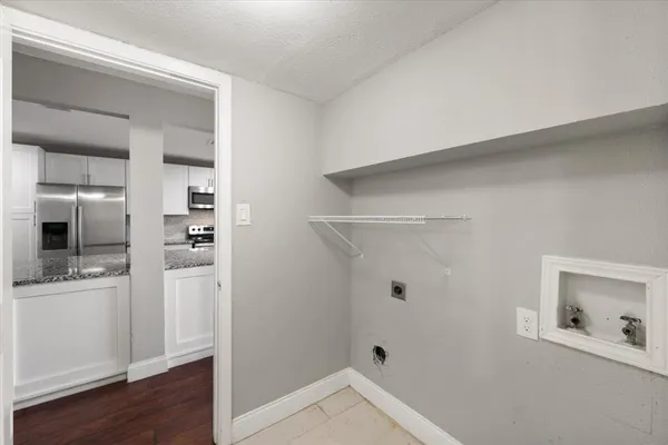 a bathroom with a granite countertop sink a shower and a mirror