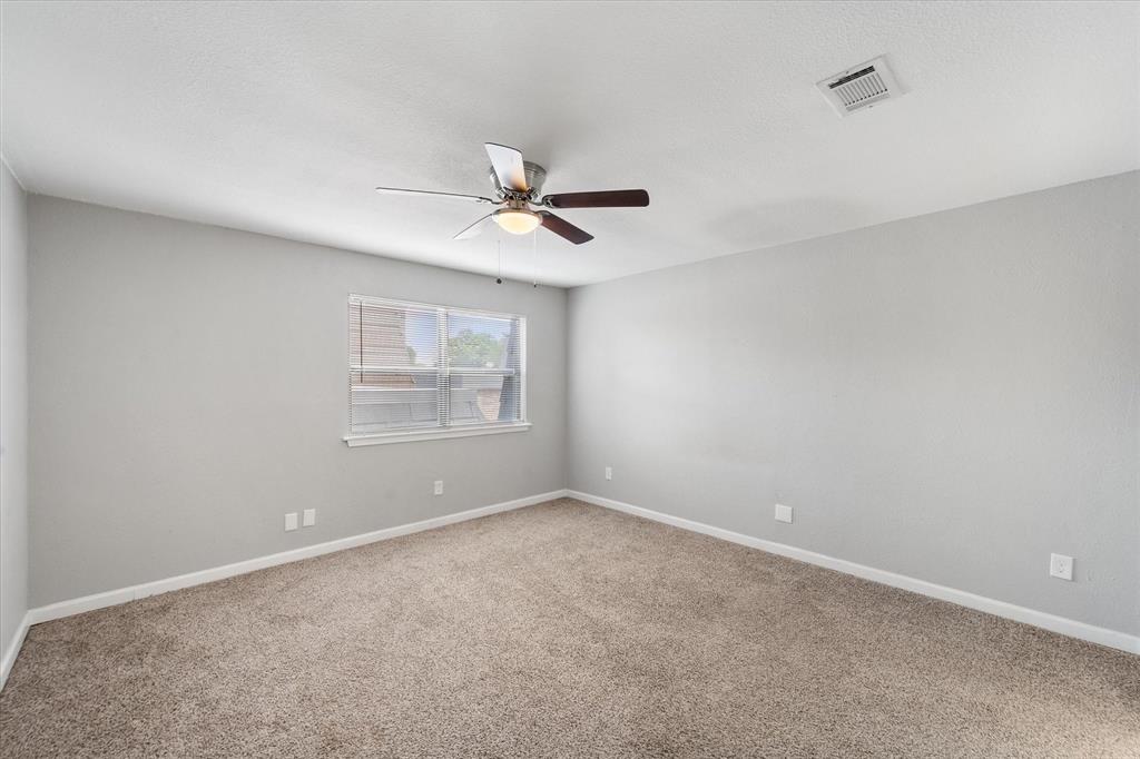 207 East Harwood Road, Unit 10 Euless, TX 76039 - Photo 21 of 34 a view of room with a ceiling fan and window