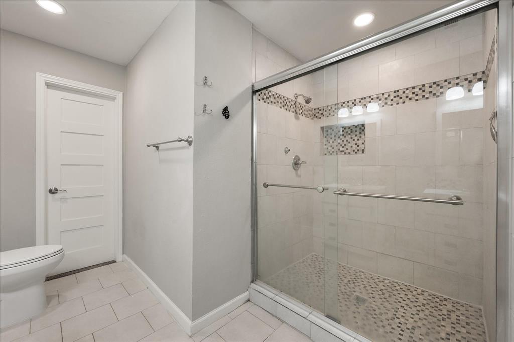 207 East Harwood Road, Unit 10 Euless, TX 76039 - Photo 24 of 34 a bathroom with a shower