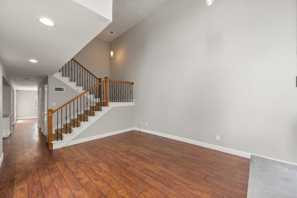 207 East Harwood Road, Unit 10 Euless, TX 76039 - Photo 4 of 34 a view of entryway with wooden floor