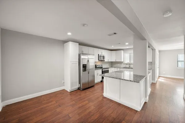 a kitchen with counter top space cabinets and stainless steel appliances