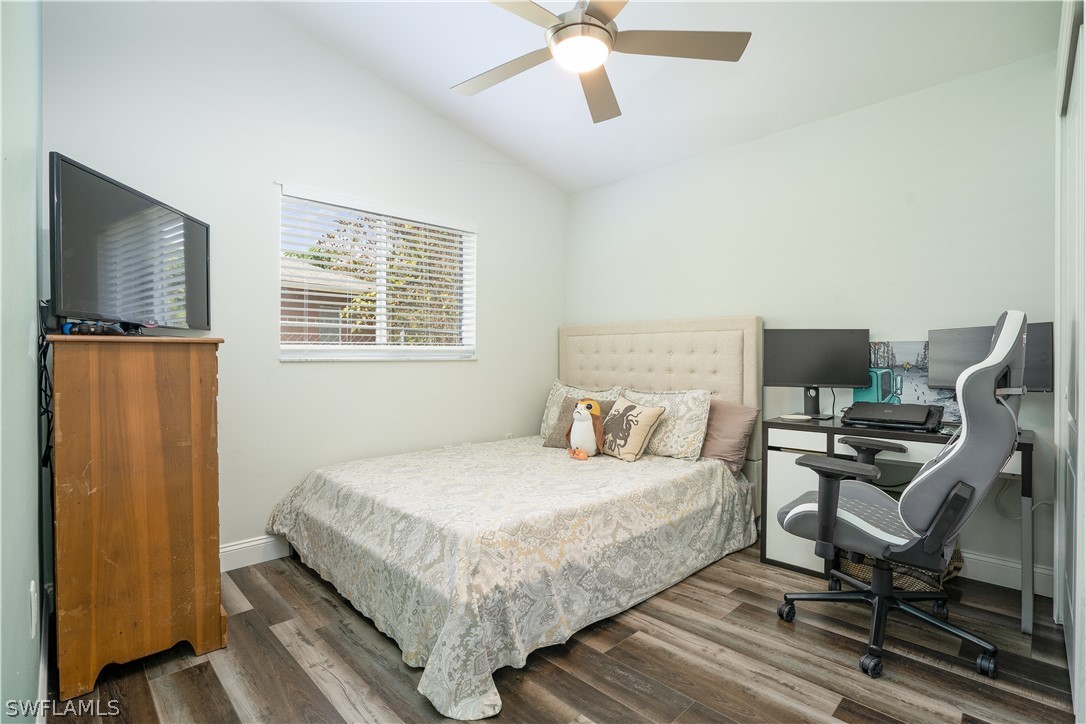 18367 Tulip Road Fort Myers, FL 33967 - Photo 11 of 13 a bedroom with a bed and a flat screen tv