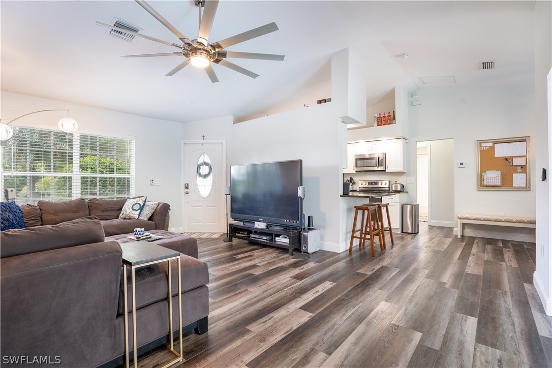 18367 Tulip Road Fort Myers, FL 33967 - Photo 6 of 13 a living room with furniture and a flat screen tv