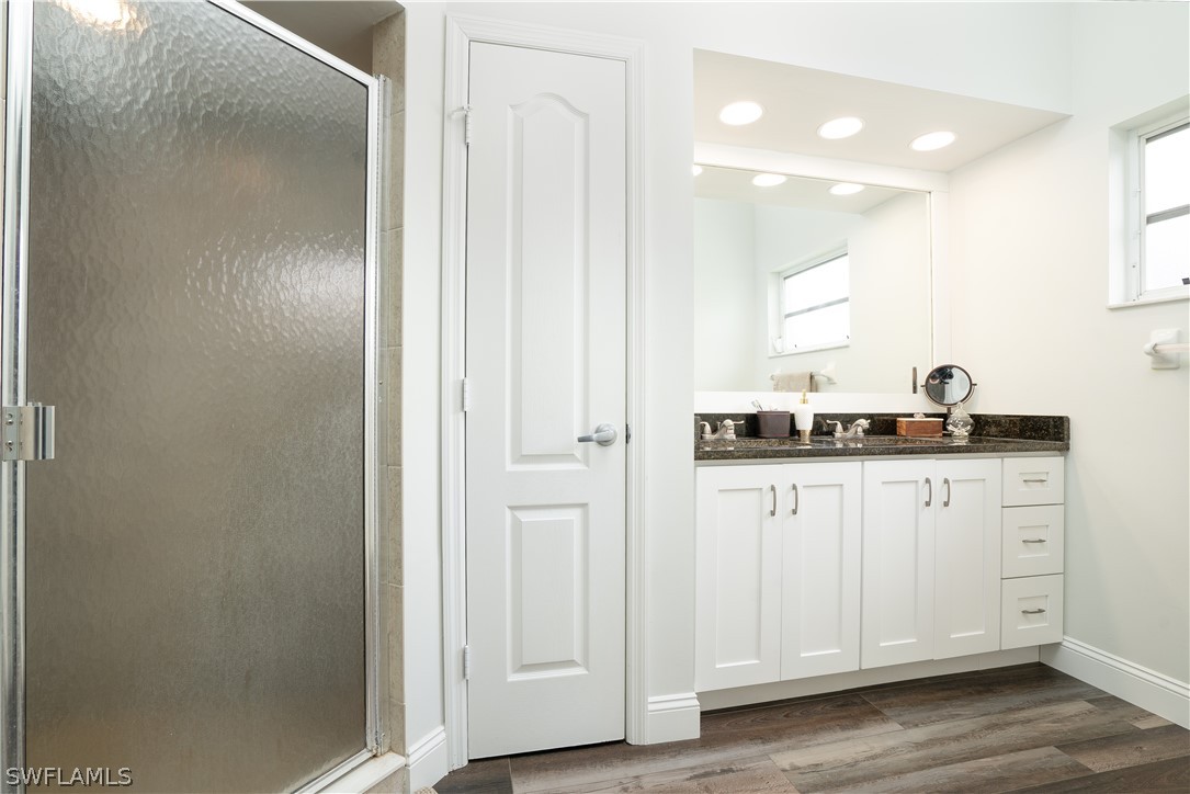 18367 Tulip Road Fort Myers, FL 33967 - Photo 10 of 13 a kitchen with white cabinets and sink
