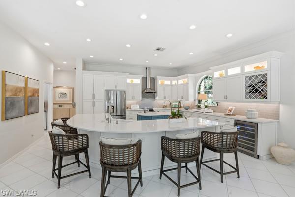 2026 Merlin Court Naples, FL 34105 - Photo 14 of 43 a dining area with a table chairs and a kitchen