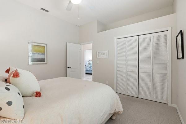 2026 Merlin Court Naples, FL 34105 - Photo 30 of 43 a bedroom with a bed and a window