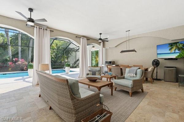 2026 Merlin Court Naples, FL 34105 - Photo 34 of 43 a living room with furniture and a large window