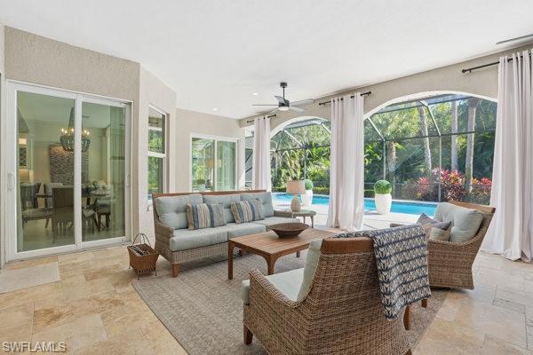 2026 Merlin Court Naples, FL 34105 - Photo 35 of 43 a living room with furniture and a large window