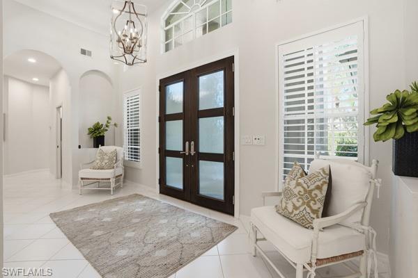2026 Merlin Court Naples, FL 34105 - Photo 5 of 43 a living room with furniture and a large window