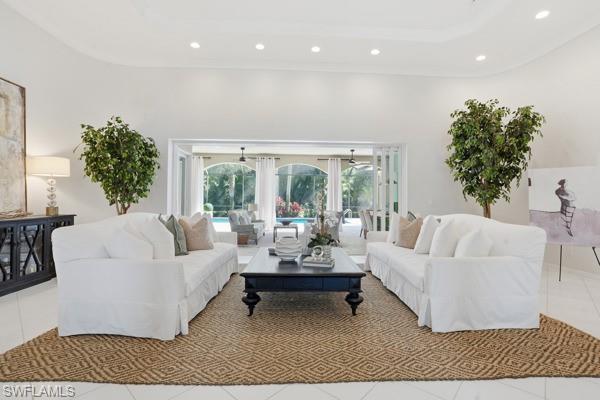 2026 Merlin Court Naples, FL 34105 - Photo 6 of 43 a living room with furniture and a large window