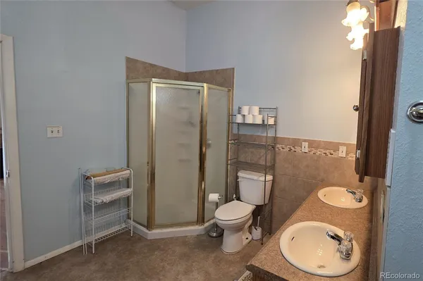 an empty room with wooden floor and window