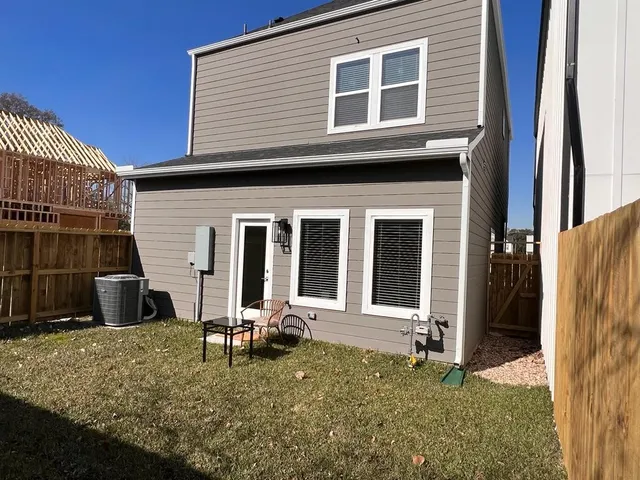 a backyard of a house with seating space