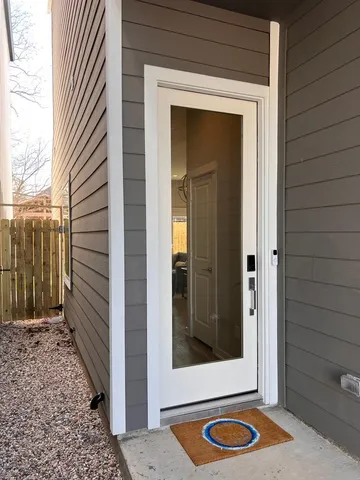 a view of a door and a window