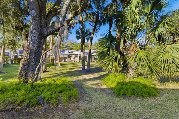 a room with furniture and a bookshelf