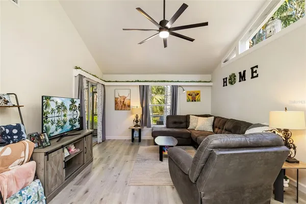 a living room with furniture and a large window