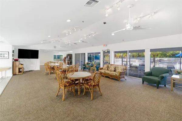 a dining room with furniture and window