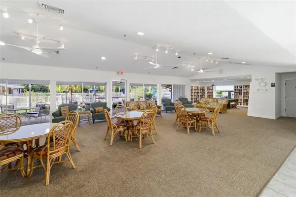a view of swimming pool with outdoor seating