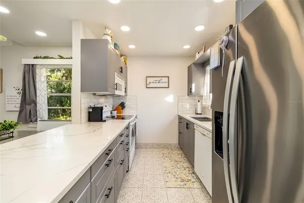 a kitchen with a sink and cabinets