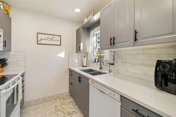 a kitchen with a stove and a microwave