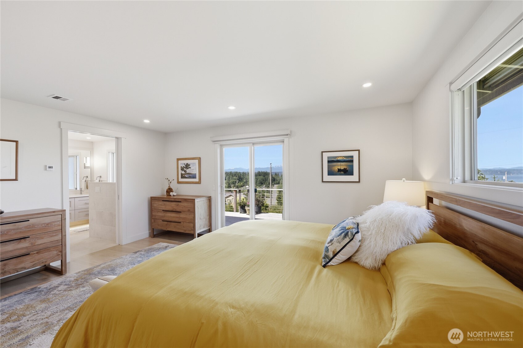 37709 Olympic View Road Northeast Hansville, WA 98340 - Photo 19 of 40 a bedroom with a bed and a window