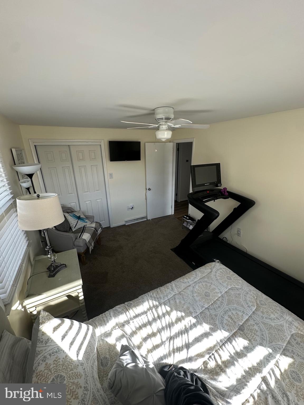 2642 Canada Hill Road Myersville, MD 21773 - Photo 15 of 33 a bedroom with a bed and a chandelier