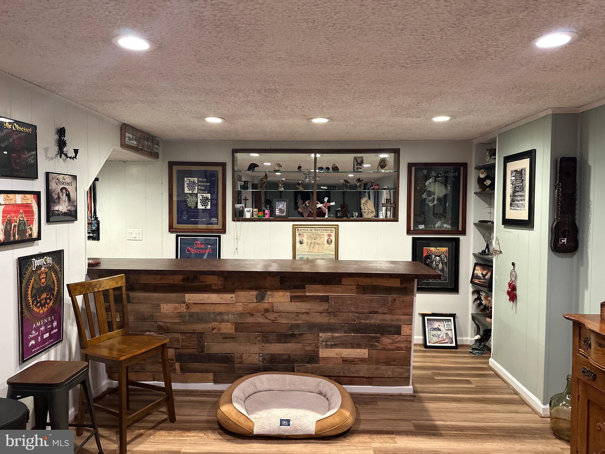 2642 Canada Hill Road Myersville, MD 21773 - Photo 24 of 33 a living room with furniture a flat screen tv and a fireplace