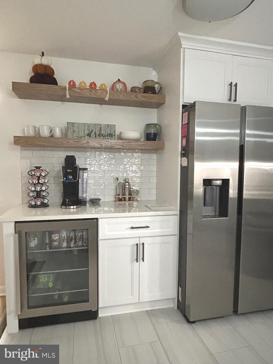 2642 Canada Hill Road Myersville, MD 21773 - Photo 9 of 33 a kitchen with a refrigerator and cabinets