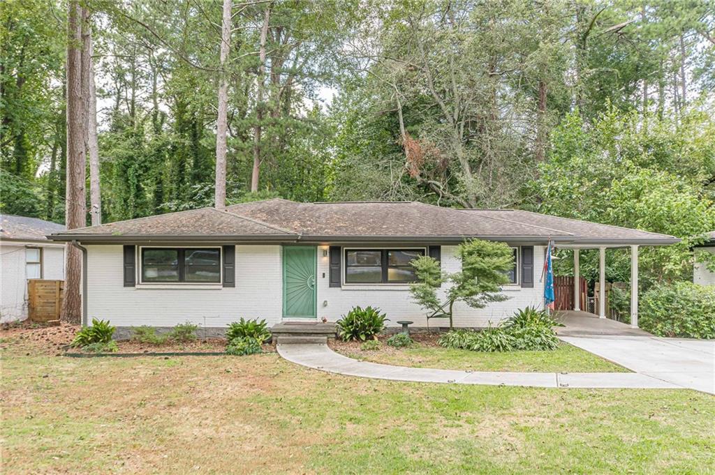 front view of a house with a yard