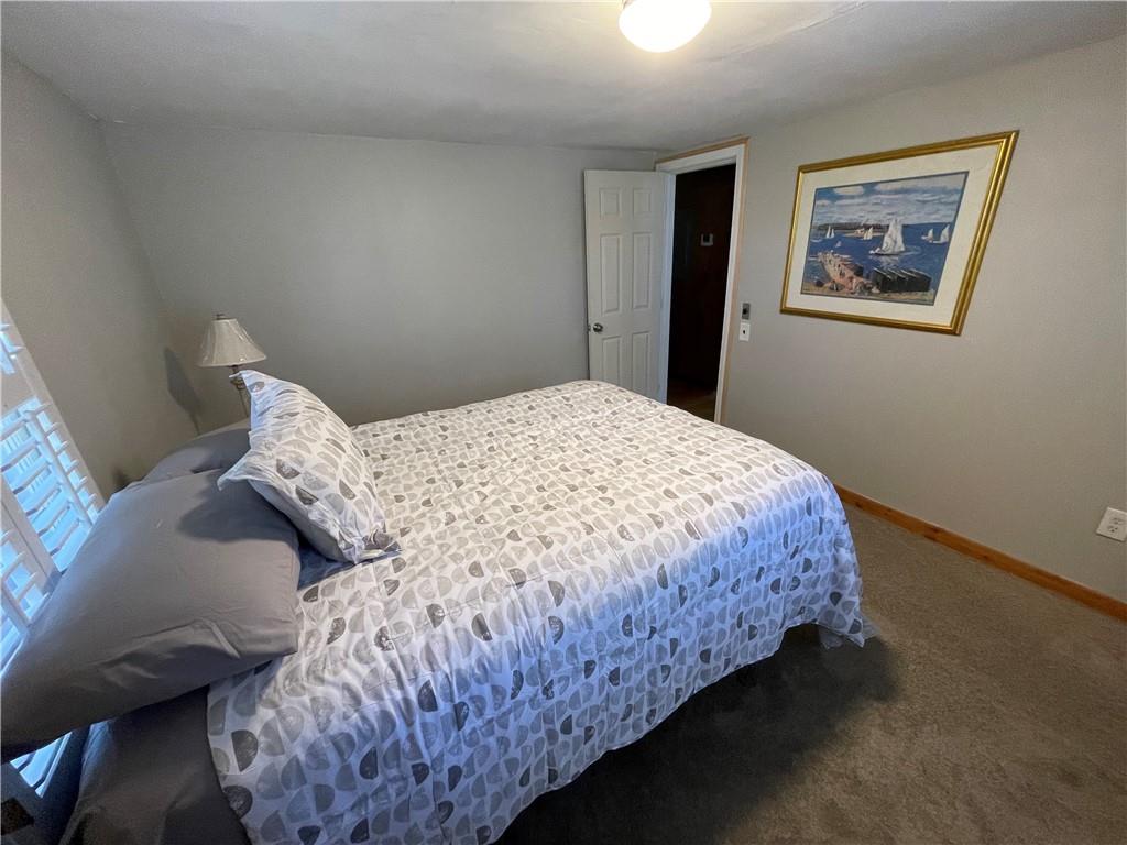 71 McGuire Road Dallas, GA 30157 - Photo 17 of 26 a bedroom with a bed and painting on the wall