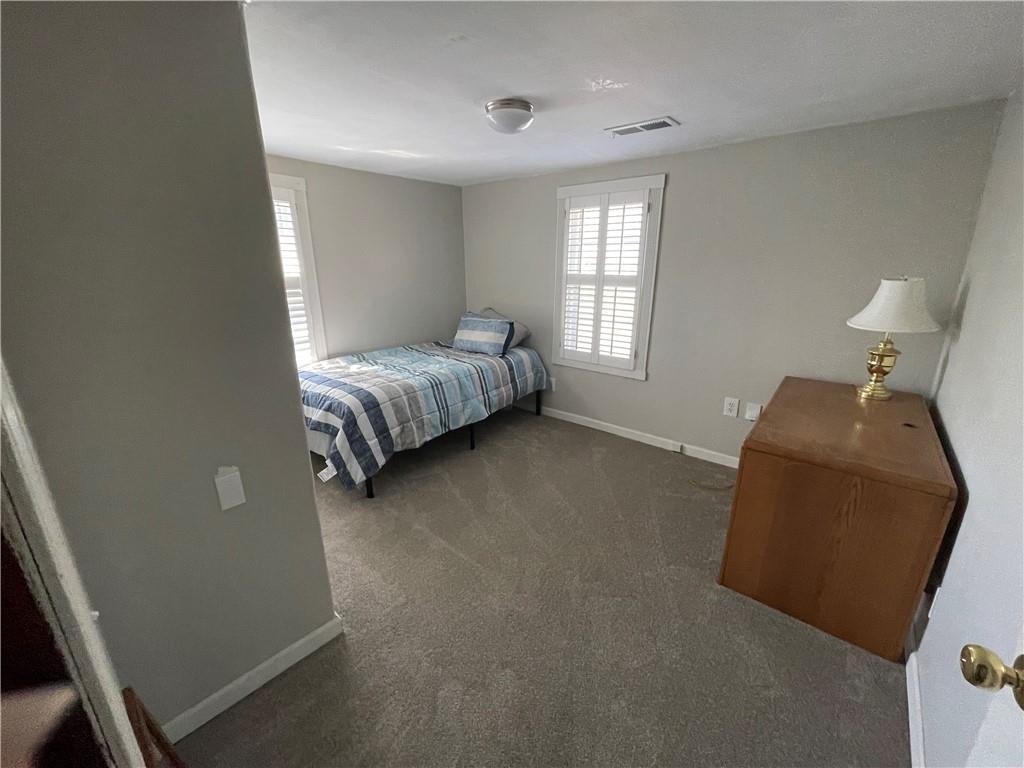 71 McGuire Road Dallas, GA 30157 - Photo 18 of 26 a bed room with a bed and a chair