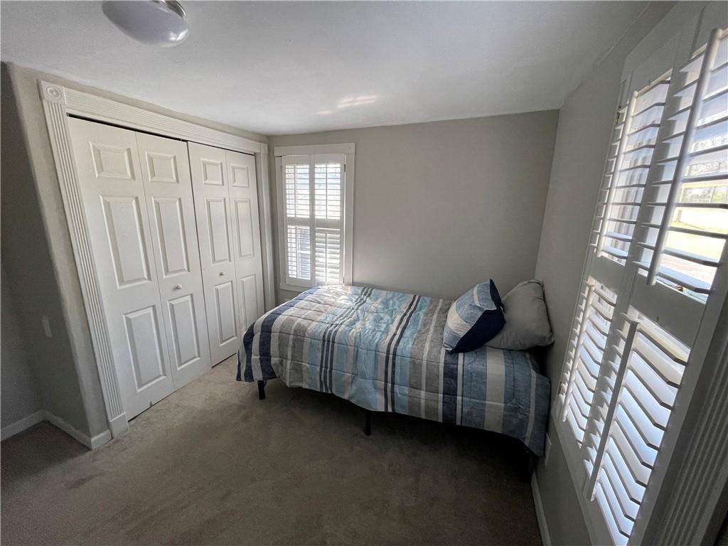 71 McGuire Road Dallas, GA 30157 - Photo 19 of 26 a bedroom with a bed and a window