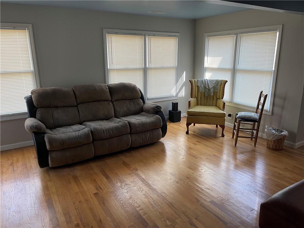 71 McGuire Road Dallas, GA 30157 - Photo 20 of 26 a living room with furniture and a wooden floor