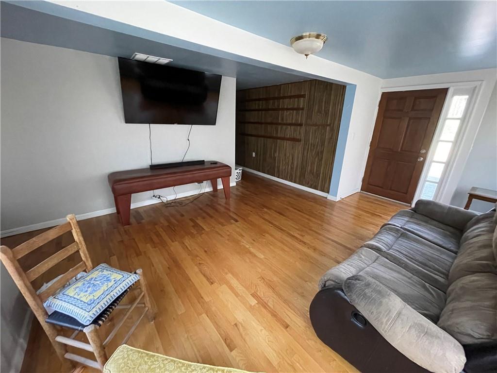 71 McGuire Road Dallas, GA 30157 - Photo 21 of 26 a living room with furniture and a flat screen tv