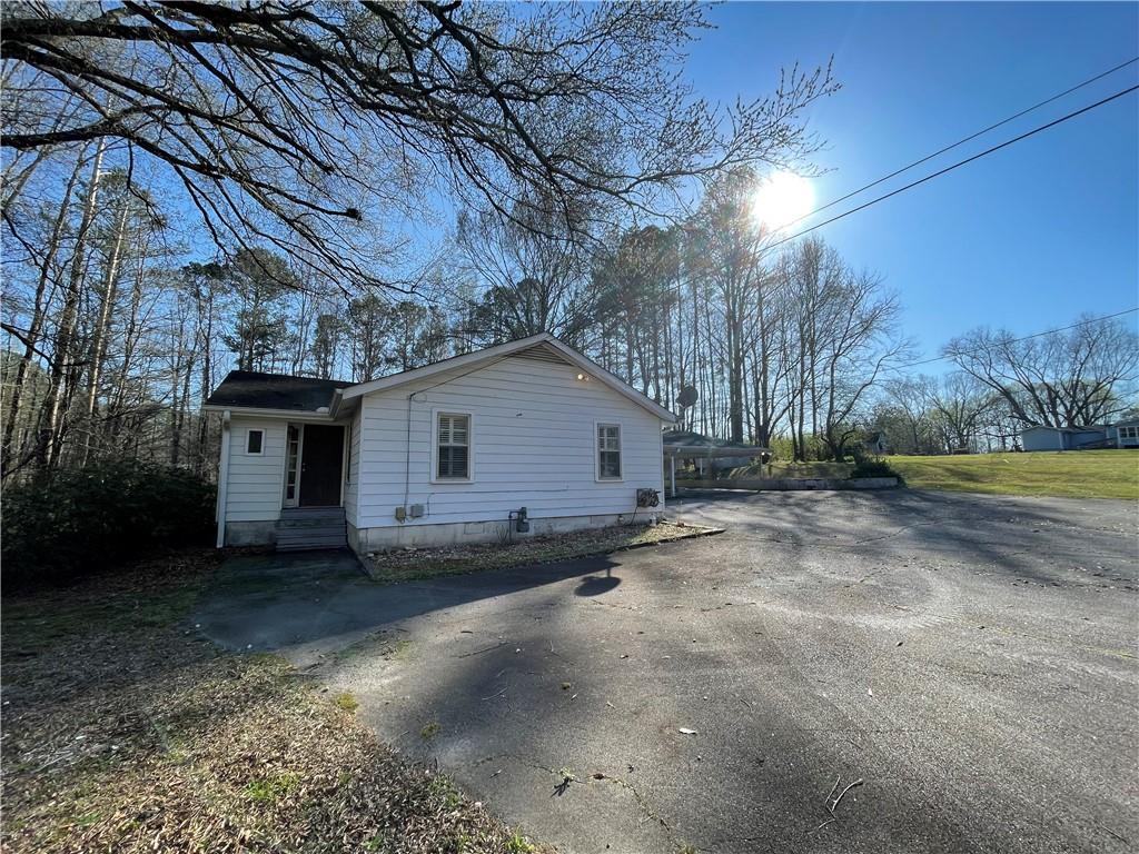 71 McGuire Road Dallas, GA 30157 - Photo 23 of 26 a view of a house with a backyard
