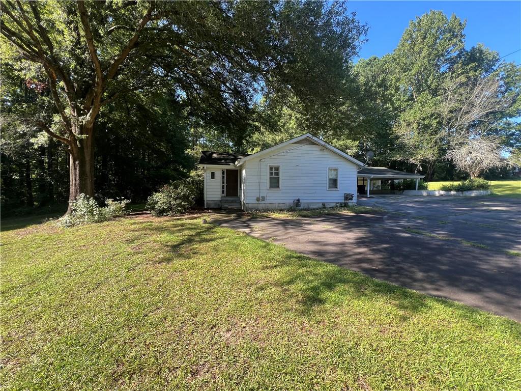 71 McGuire Road Dallas, GA 30157 - Photo 4 of 26 a view of a house with a yard